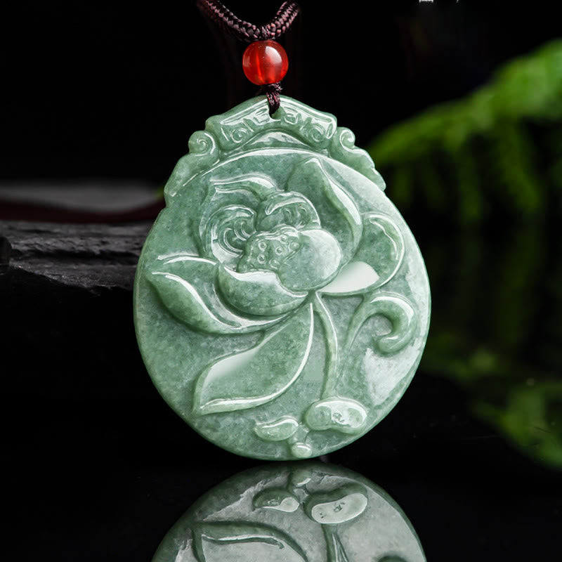 Round Lotus Jade Necklace - jade lotus on glossy black with foliage, serene