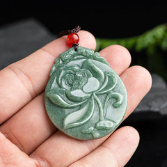 Round Lotus Jade Necklace - jade lotus held in hand showing scale, authentic craft