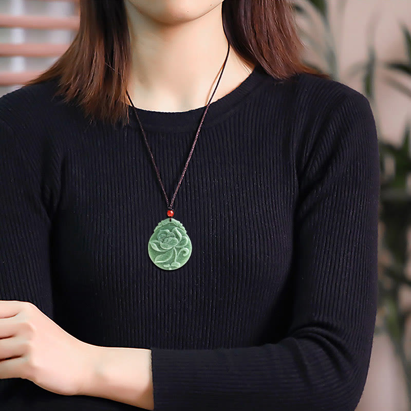 Round Lotus Jade Necklace - worn on model with black sweater, timeless