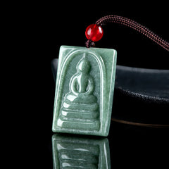 Formless Buddha Jade Square Amulet Necklace – on black satin fabric, jade glow and elegant drape display