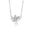 Sterling Silver Lotus Pendant Necklace - on curved white display stand with bokeh, delicate
