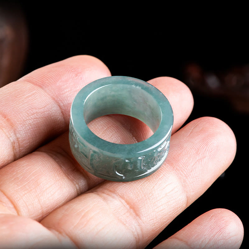 Jade Om Mani Padme Hum Ring – Resting on palm showing mantra engraving, jade band