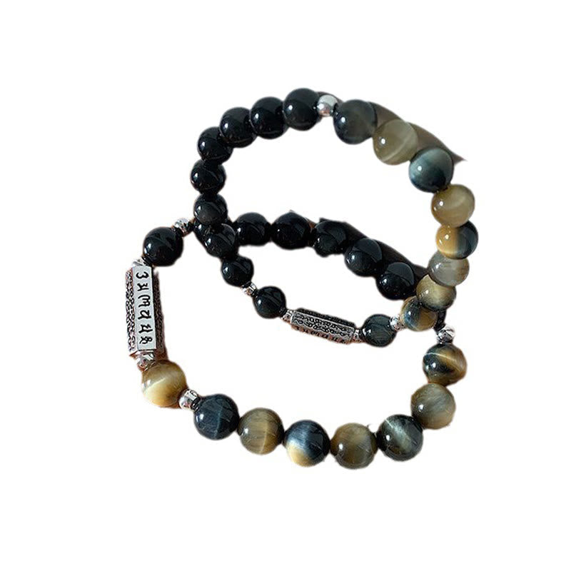 Black Obsidian Tiger Eye Bracelet – Two coiled bracelets on white background showing chatoyant stone beads, beaded jewelry