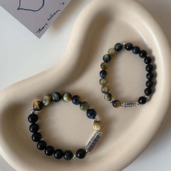 Black Obsidian Tiger Eye Bracelet – Matching pair showing obsidian and tiger eye bead halves, couple bracelets