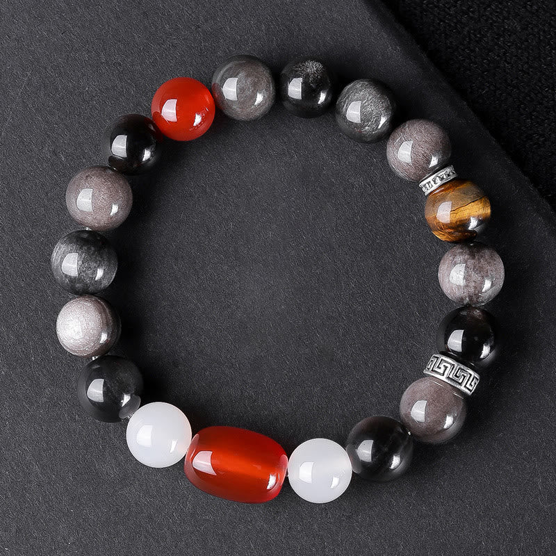 Om Mani Padme Hum Bracelet – Overhead view, gray obsidian with red carnelian and tiger eye