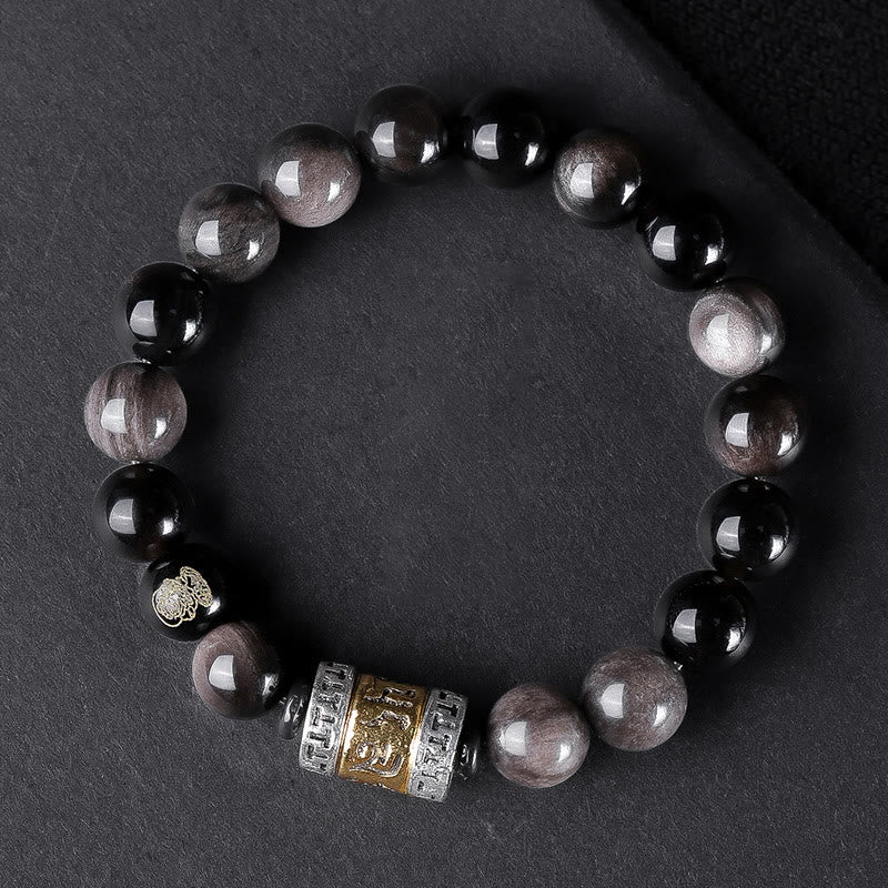 Om Mani Padme Hum Bracelet – Black and silver beads with tri-color metal mantra cylinder
