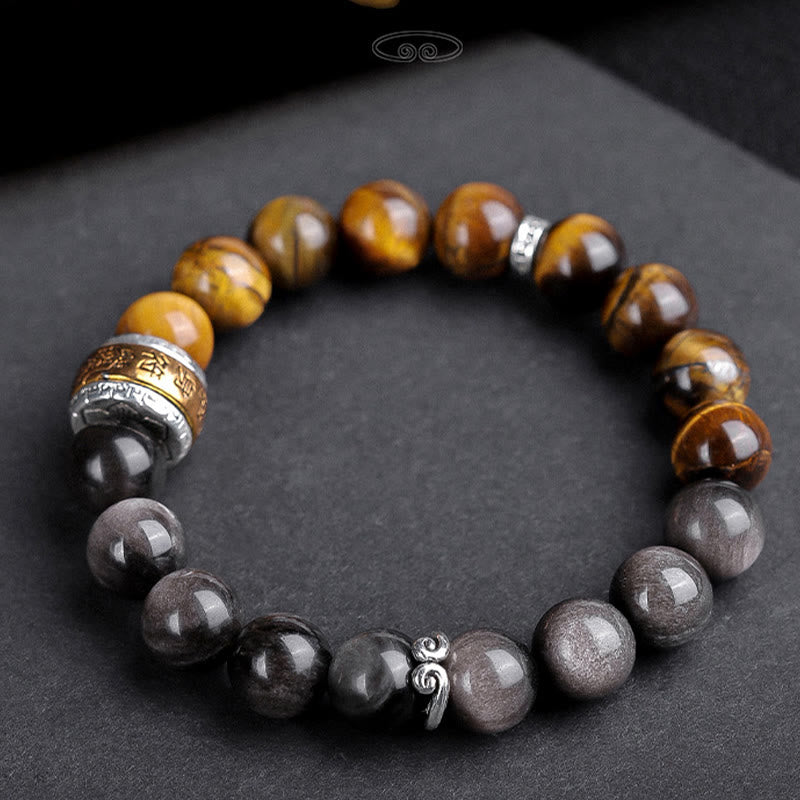 Om Mani Padme Hum Bracelet – Overhead view, tiger eye and obsidian beads with metal mantra cylinder