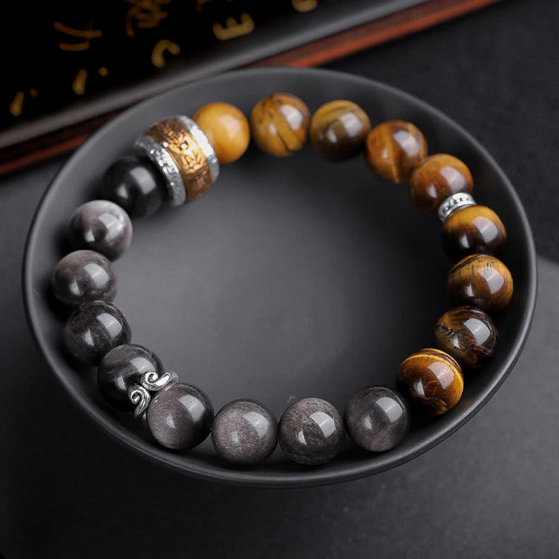 Om Mani Padme Hum Bracelet – Displayed in black bowl, overhead view of beaded arrangement