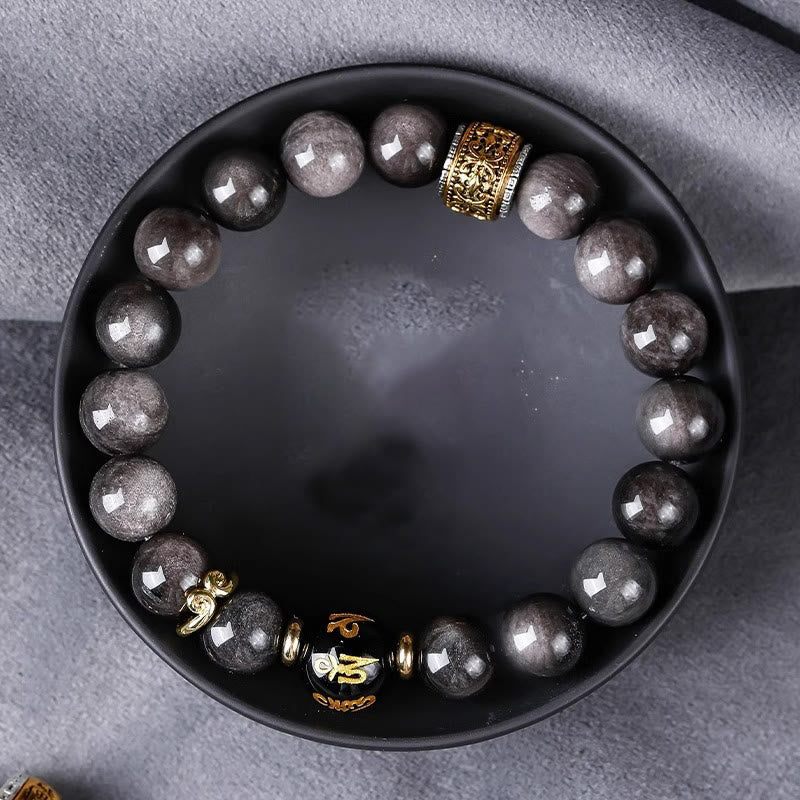 Om Mani Padme Hum Bracelet – In matte black dish, obsidian beads with gold symbolic focal bead