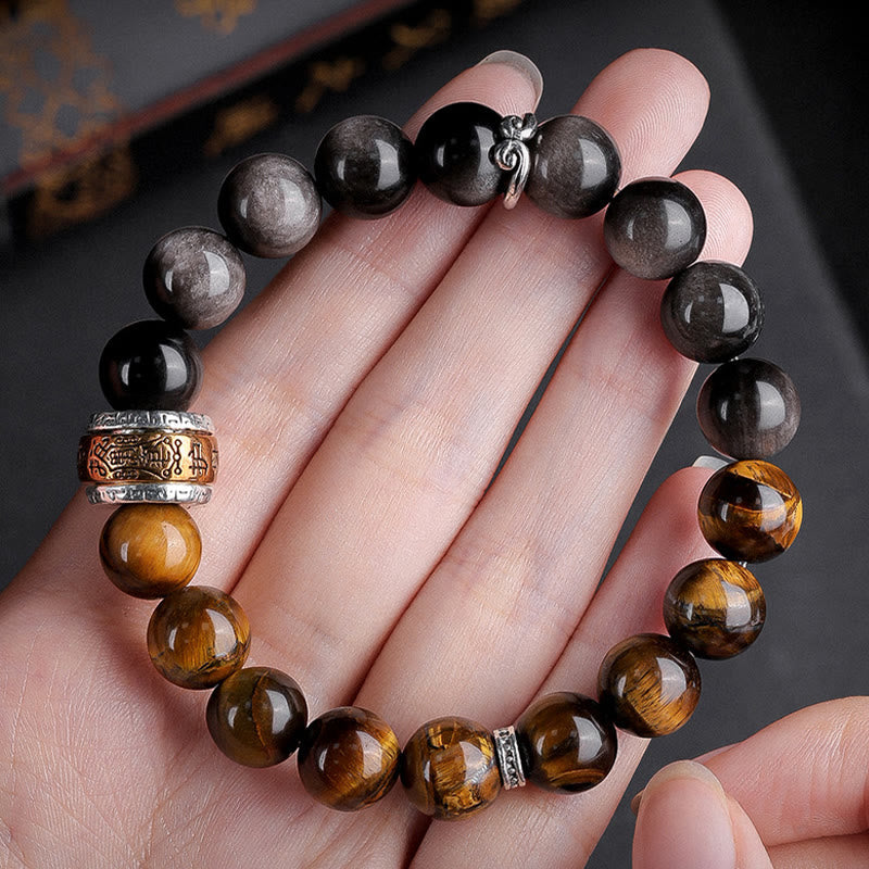 Om Mani Padme Hum Bracelet – Resting on open palm, tiger eye and obsidian bead contrast