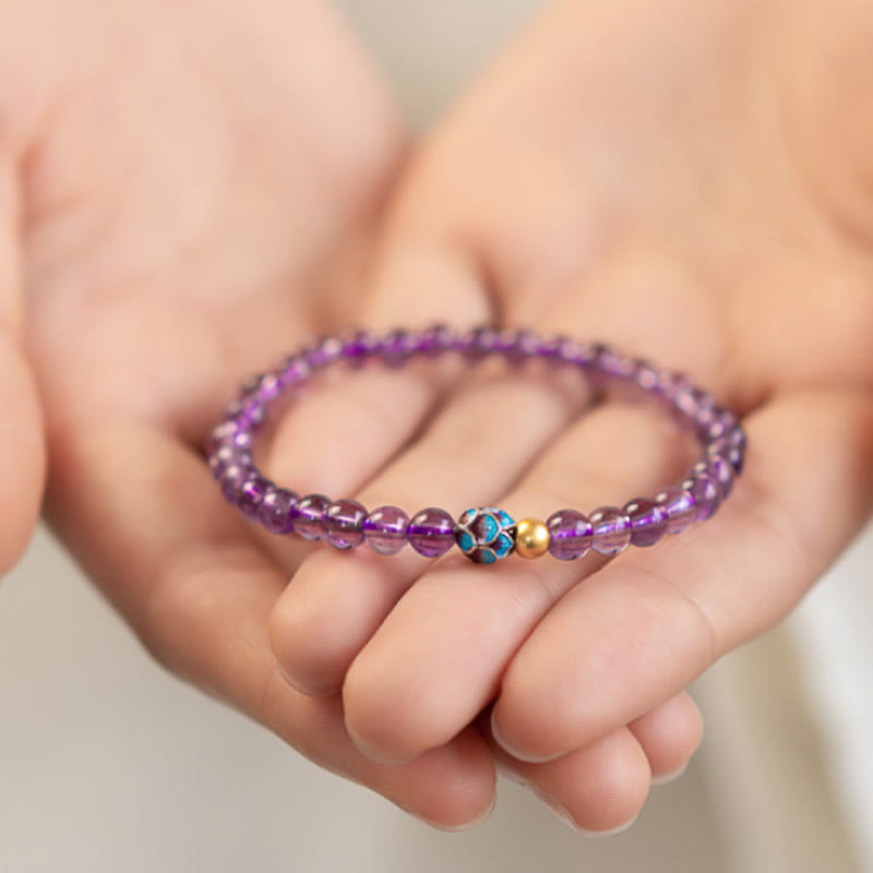 Natural Amethyst Lotus Spiritual Awareness Bracelet - purple amethyst held gently in cupped hands, healing