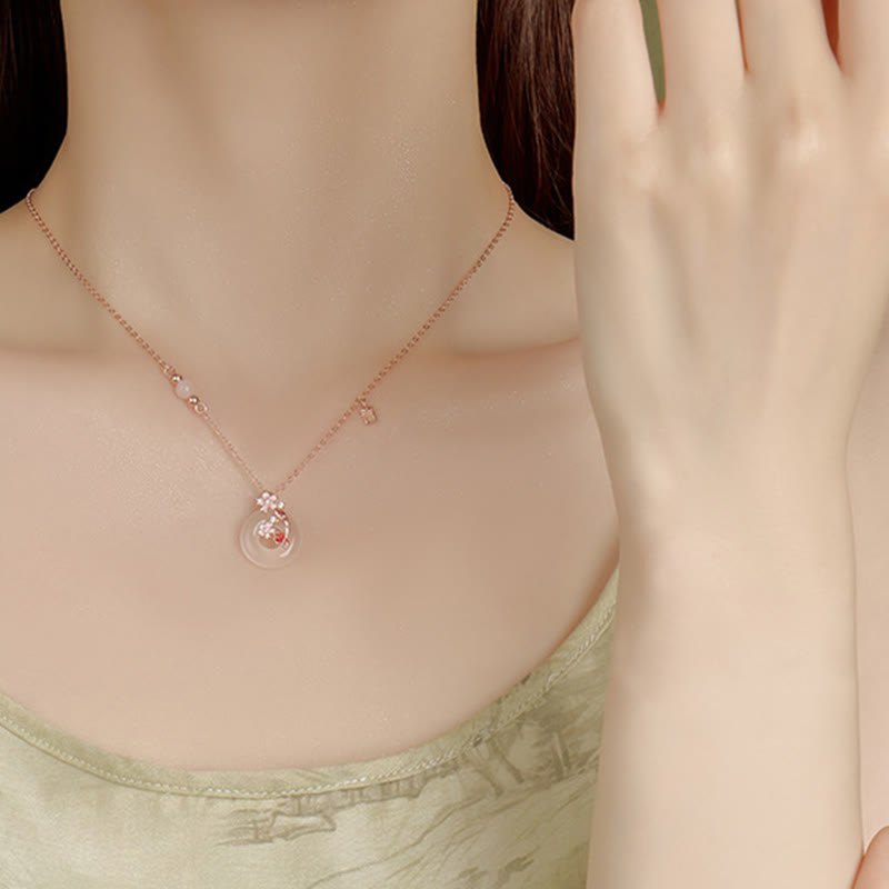 Chalcedony Koi Fish Peace Buckle Necklace – worn on decolletage, square charm and floral pendant, light green top