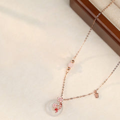 Chalcedony Koi Fish Peace Buckle Necklace – full necklace on cream, donut pendant with cherry blossom branch, tag charm