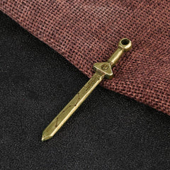 Vintage Yin Yang Copper Sword Necklace - close-up of antique copper sword pendant with yin-yang guard and Chinese engravin...
