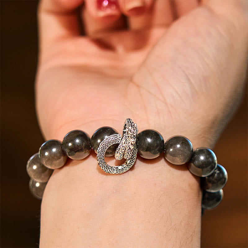 Silver Sheen Obsidian Dragon Protection Bracelet | Strength & Power – dragon charm bracelet worn on wrist, powerful look
