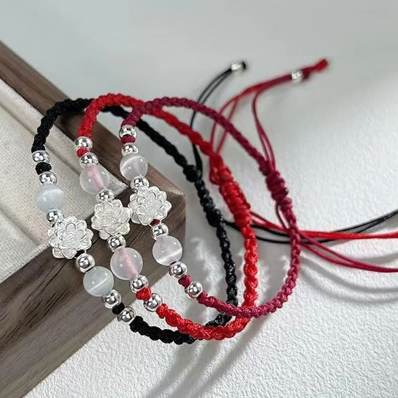 Sterling Silver Lotus Cat's Eye String Bracelet - three cord color variants on dark wood prop, elegant