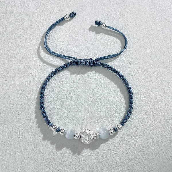 Sterling Silver Lotus Cat's Eye String Bracelet - denim blue cord with silver flower, serene elegance