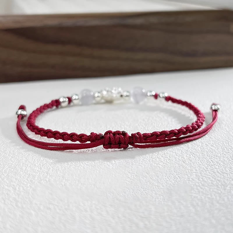 Sterling Silver Lotus Cat's Eye String Bracelet - double-strand burgundy cord with white beads, refined