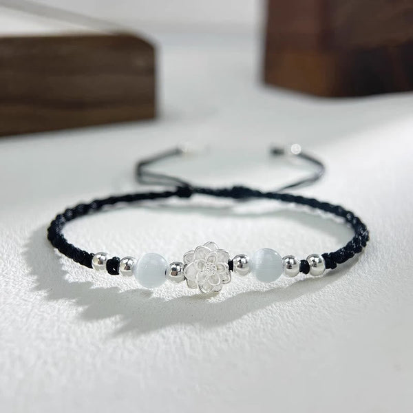 Sterling Silver Lotus Cat's Eye String Bracelet - black cord with silver lotus and white cat's eye beads, clarity