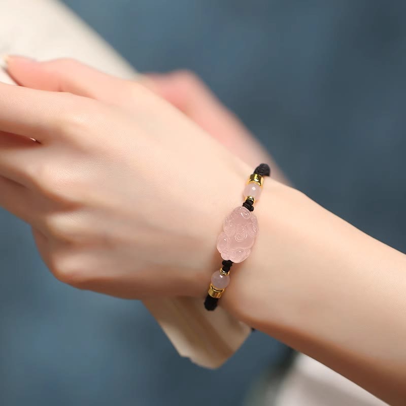 Pink Crystal PiXiu Bracelet – Black cord variant worn on wrist, pink crystal wealth charm
