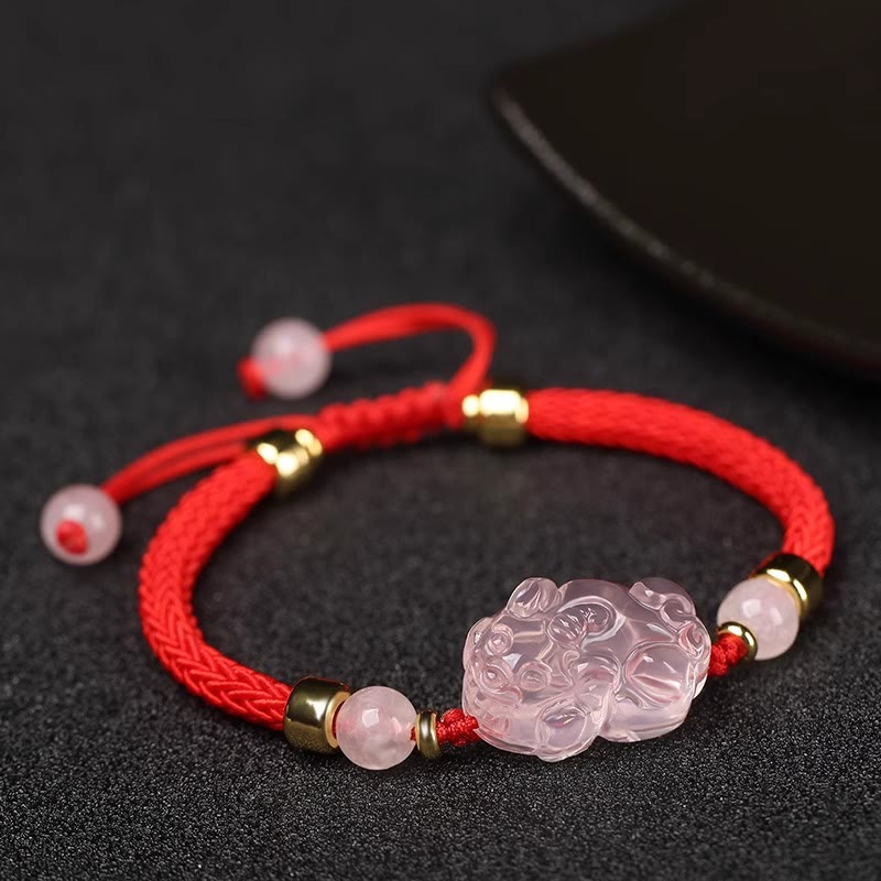 Pink Crystal PiXiu Bracelet – Red braided cord with pink crystal PiXiu charm and gold beads on black