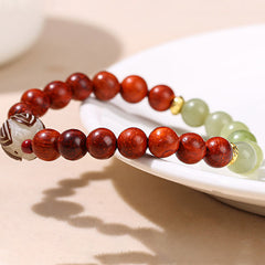 Rosewood Cyan Jade Bodhi Lotus Bracelet - rosewood jade beads on carved wooden stand, Mindfulness