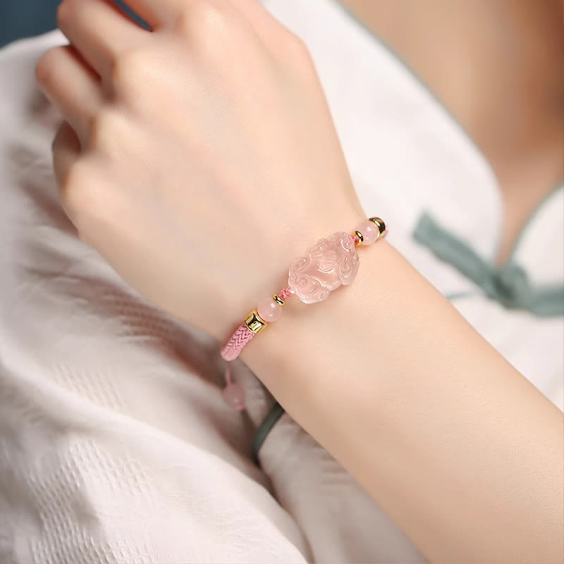 Pink Crystal PiXiu Bracelet – Pink cord worn on wrist with white blouse, love jewelry