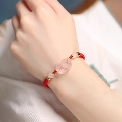 Pink Crystal PiXiu Bracelet – Worn on wrist with white blouse, red cord wealth love jewelry