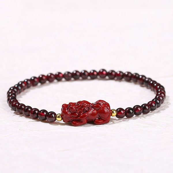 Garnet Cinnabar PiXiu Bracelet – front view centered white background red PiXiu gold beads, FengShui love
