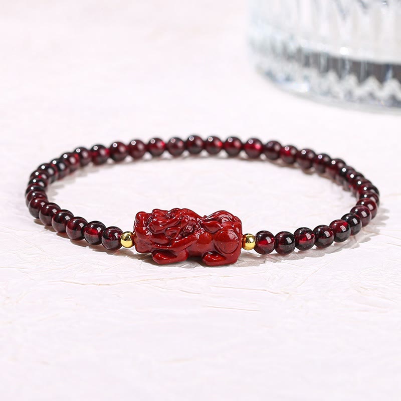 Garnet Cinnabar PiXiu Bracelet – garnet beads red cinnabar PiXiu gold spacers white background, passion jewelry