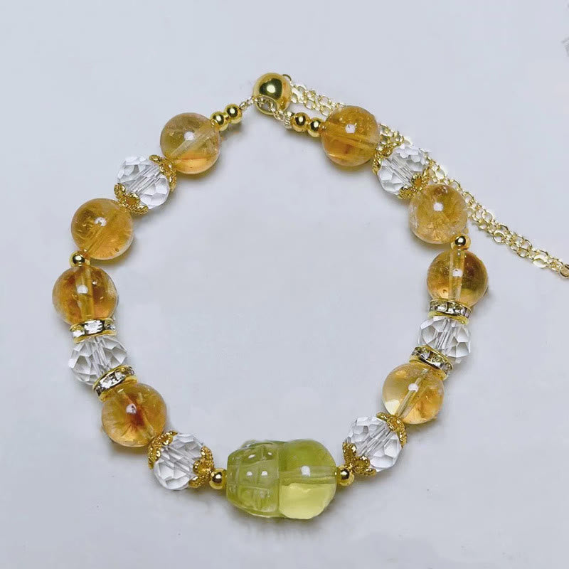 Natural Citrine PiXiu Bracelet – flat lay white background adjustable gold chain, citrine wealth bracelet