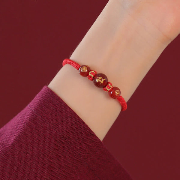 Red Agate Chinese Zodiac Red String Braided Bracelet | Protection – gold Dragon on braided cord, wrist protection