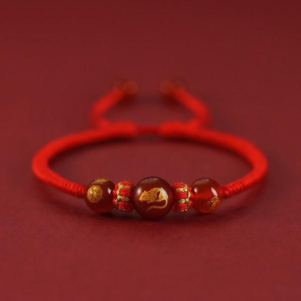 Red Agate Chinese Zodiac Red String Braided Bracelet | Protection – gold Rat zodiac charm on braided red string, fortune