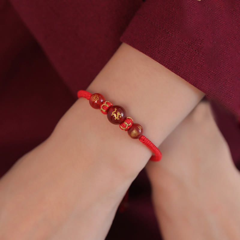 Red Agate Chinese Zodiac Red String Braided Bracelet | Protection – Dragon bead lifestyle shot, traditional craft