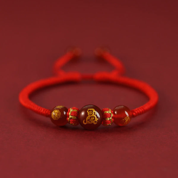 Red Agate Chinese Zodiac Red String Braided Bracelet | Protection – gold Monkey zodiac bead on red cord, cleverness charm