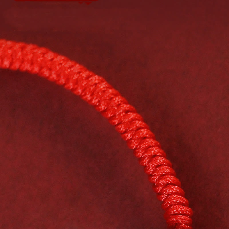 Red Agate Chinese Zodiac Red String Braided Bracelet | Protection – braided red cord texture close-up, handcrafted knotting