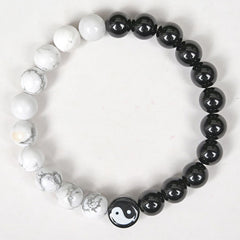 Obsidian White Turquoise Yin Yang Bracelet - top-down flat lay of black obsidian and white turquoise bead bracelet with yi...