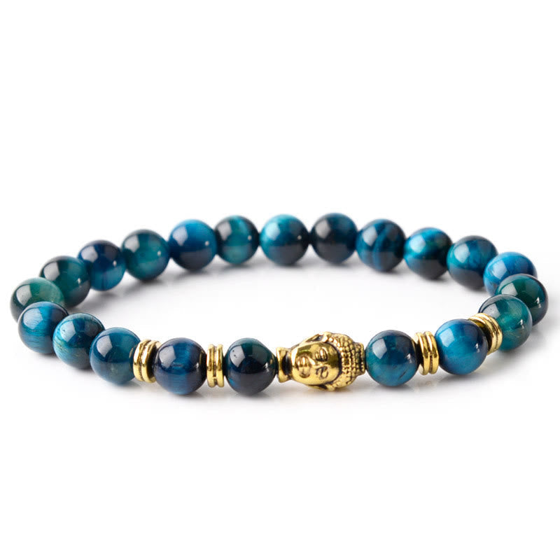 Blue Green Red Tiger Eye Buddha Bracelet – Flat lay on slate stone, natural mineral pairing, earthy vibe