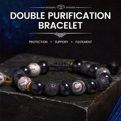 Black Obsidian Lava Rock Yin Yang Bracelet - moody styled shot with BUDDHA STONES branding, dark blue backdrop