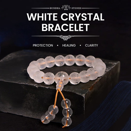 White Crystal Mantra Bracelet – Frosted beads with tassel on dark slate, meditation jewelry