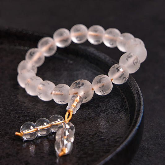 White Crystal Mantra Bracelet – Etched Tibetan characters on frosted beads, golden cord tassel