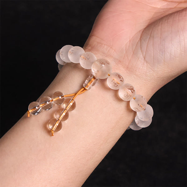 Om Mani Padme Hum Bracelet - Golden-engraved crystal beads on wrist with orange tassel, zen bracelet
