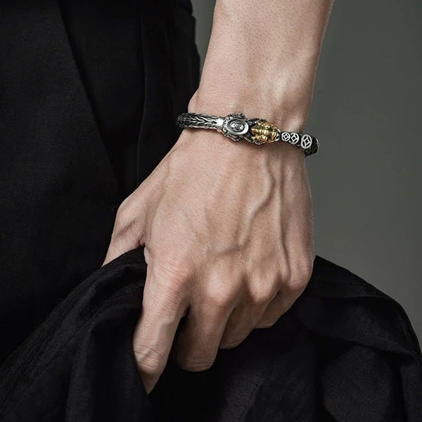 Sterling Silver PiXiu Coins Bracelet – Male hand with silver PiXiu bangle holding fabric, bold accessory