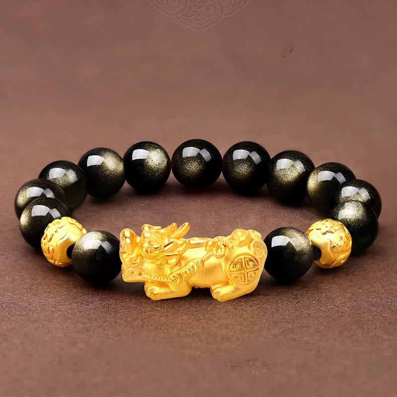 Gold Sheen Obsidian PiXiu Bracelet – Gold PiXiu with obsidian beads on brown fabric, wealth amulet