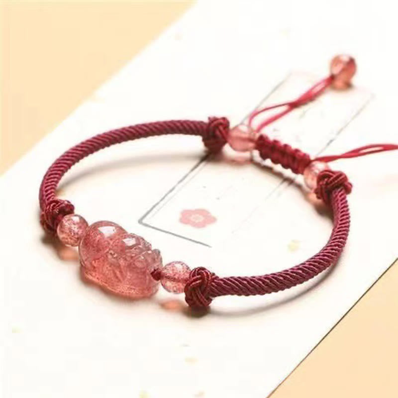 Strawberry Quartz PiXiu Bracelet – red string bracelet with pink PiXiu on white card, flower accent, adjustable
