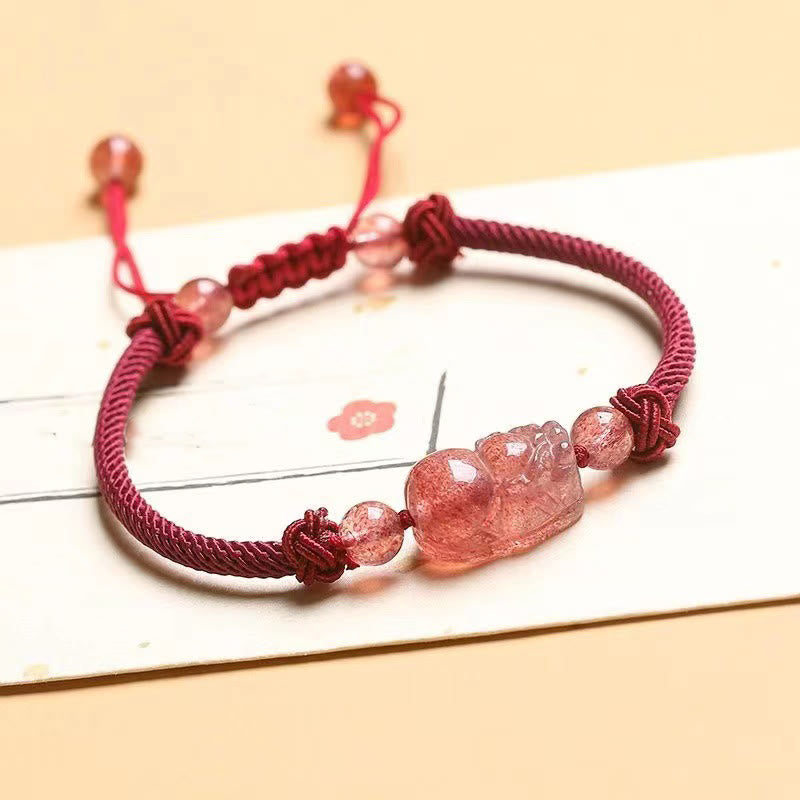Strawberry Quartz PiXiu Bracelet – red braided cord with pink strawberry quartz PiXiu on white card, love charm