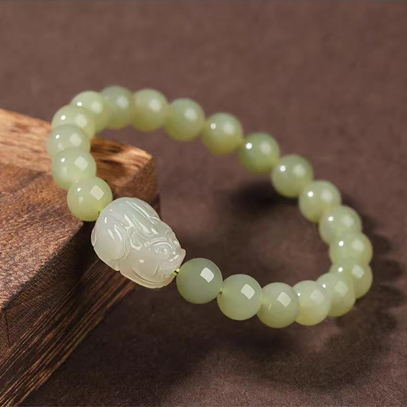 Hetian Jade PiXiu Bracelet – light green jade beads and PiXiu carving on wood, close-up detail, harmony