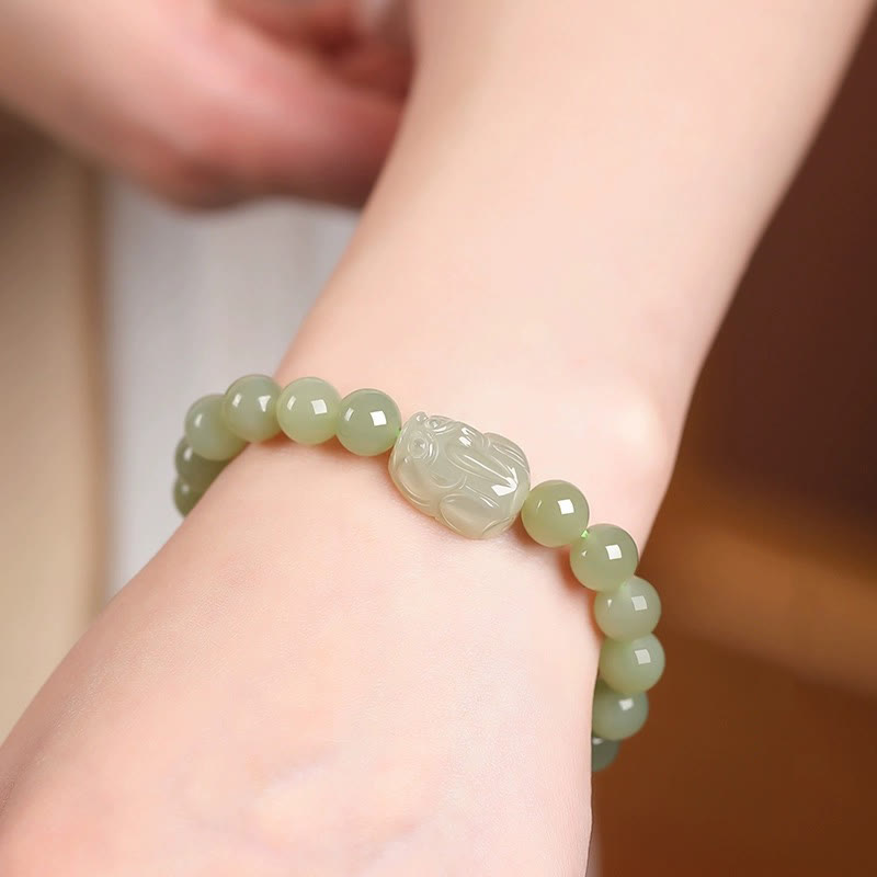 Hetian Jade PiXiu Bracelet – light green jade bracelet worn on wrist, showing fit, fortune accessory