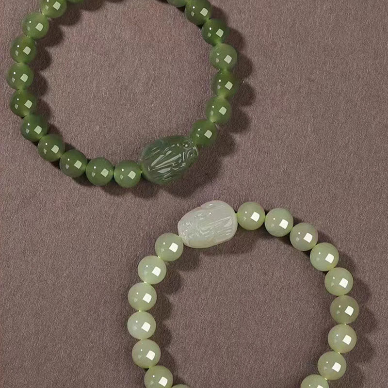 Hetian Jade PiXiu Bracelet – two bracelets, light and dark green jade with PiXiu, comparison shot
