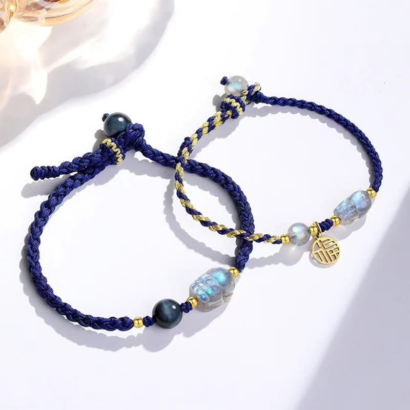 Moonstone PiXiu Tiger Eye Couple Bracelet – two blue braided couple bracelets with moonstone PiXiu and Fu charm, his and hers